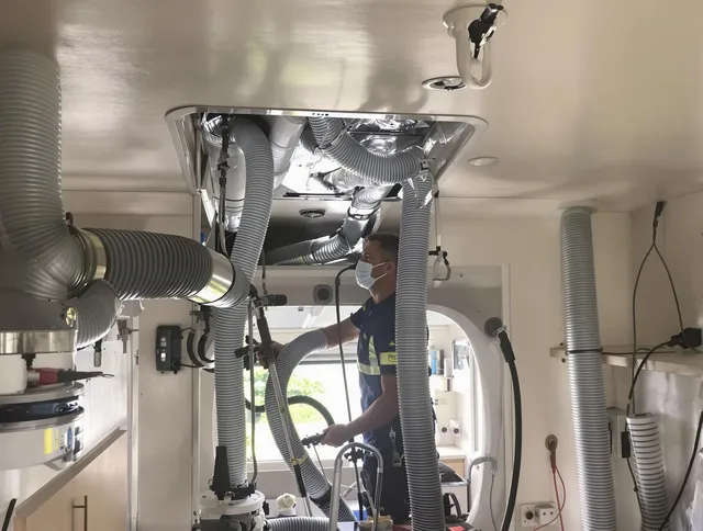 Duxbury Air Duct Cleaning specialist performing precise mobile home duct cleaning in Duxbury