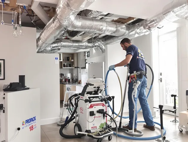 Duxbury Air Duct Cleaning technician performing advanced pure duct cleaning with specialized equipment in Duxbury