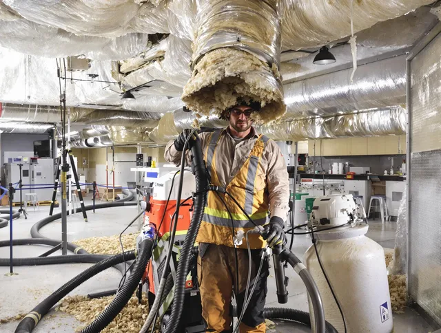 Professional vacuum insulation removal by Duxbury Air Duct Cleaning expert in Duxbury